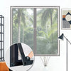 A magnetic window screen and mosquito net assembly shown in a framed window with surrounding greenery.