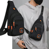 Black water-resistant crossbody bag worn by a person, featuring multiple compartments and an adjustable strap.