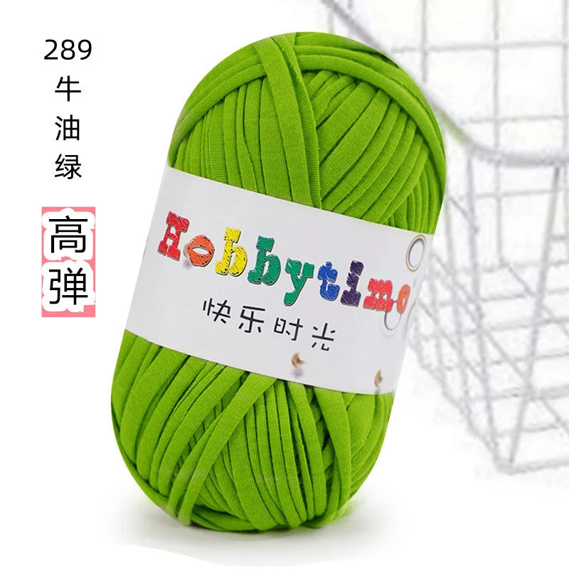 A ball of bright green soft T-shirt yarn used for crochet and knitting projects.