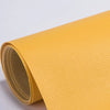Roll of yellow self-adhesive PU leather repair patches, showing the texture and thickness.
