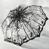 A retro transparent arch umbrella featuring a black silhouette of trees and wildlife.