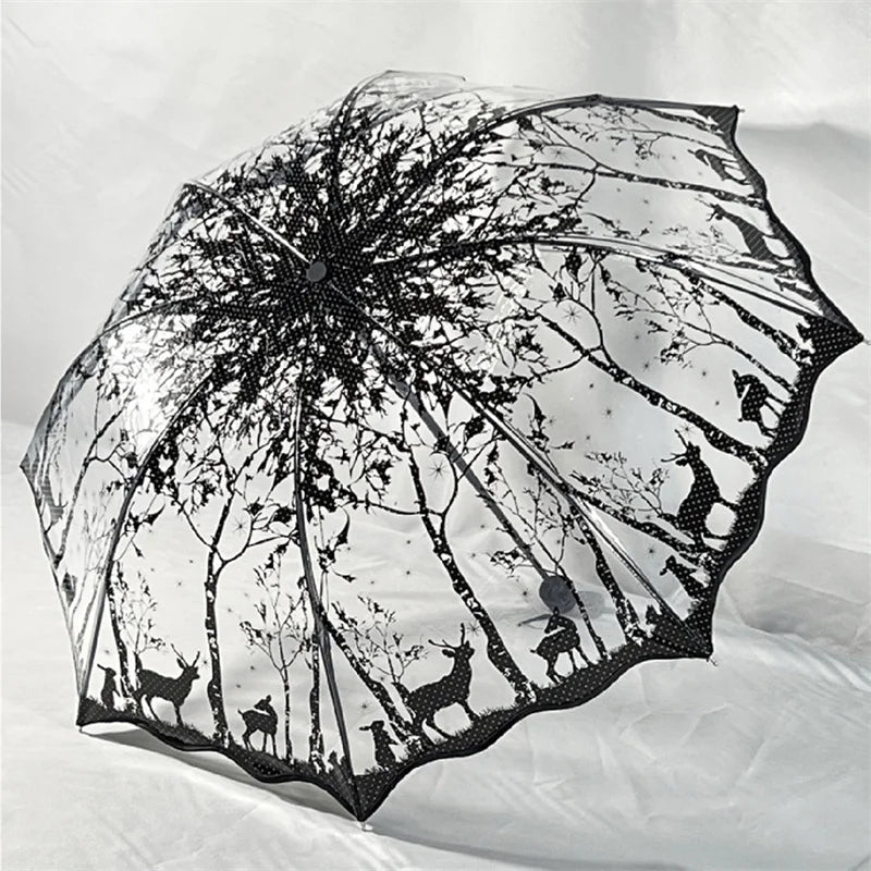 A retro transparent arch umbrella featuring a black silhouette of trees and wildlife.