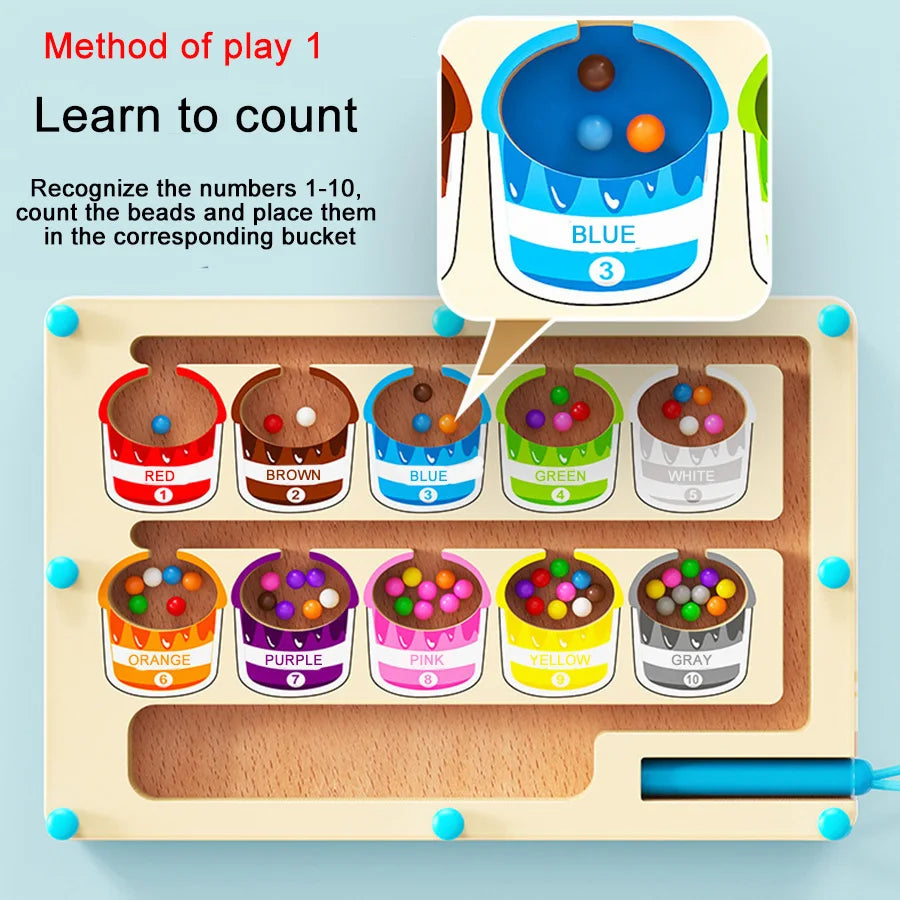 A wooden sorting maze board for toddlers showing colored beads and corresponding labeled buckets.