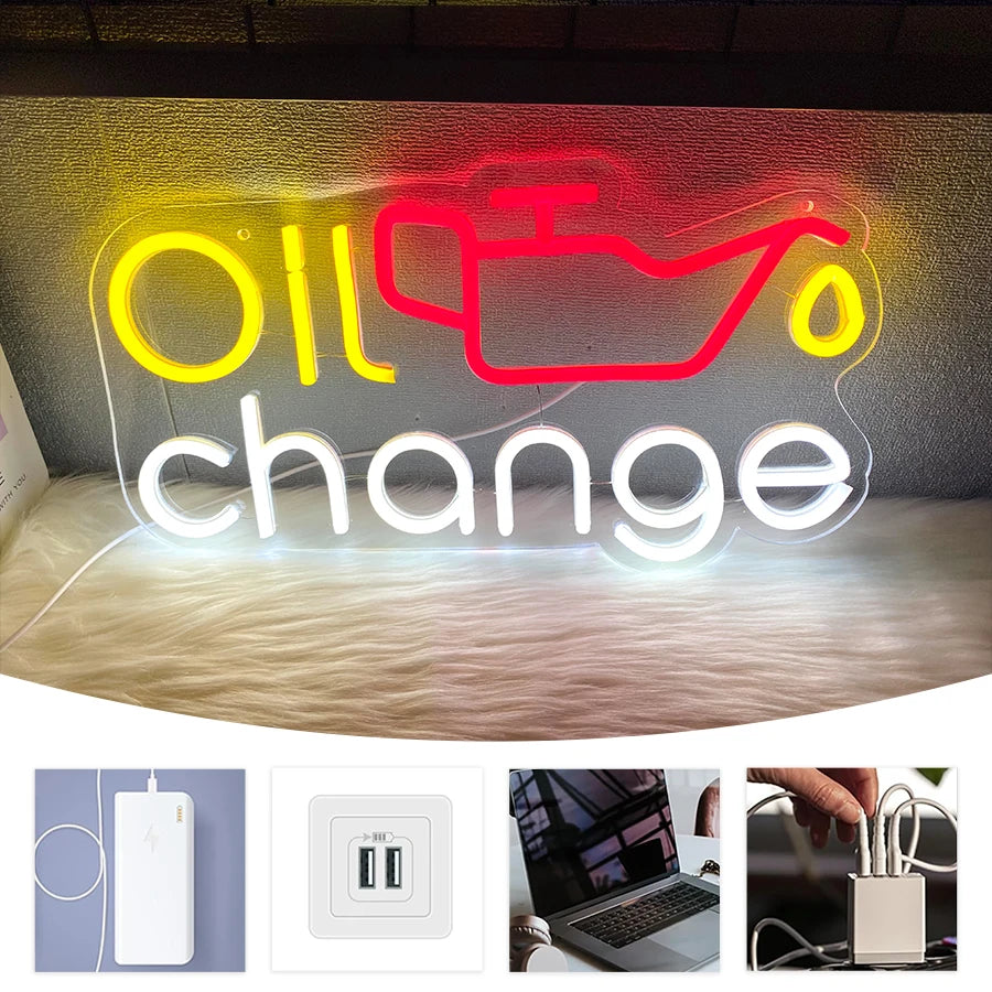 Neon sign displaying the words Oil change with red and yellow glowing text.