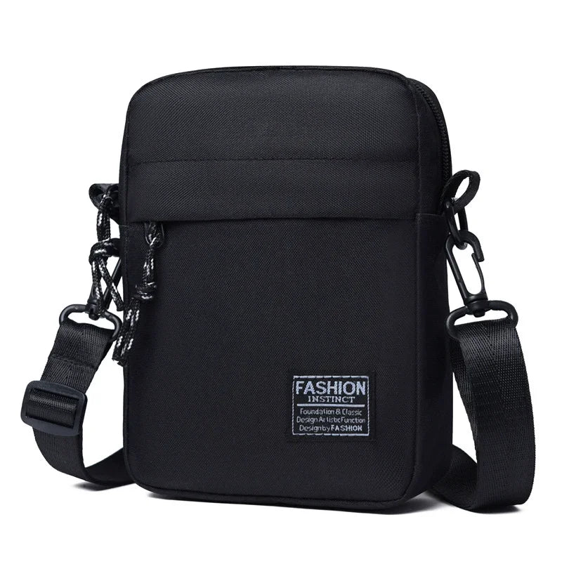 Black mini crossbody phone bag with adjustable strap shown against a white background.