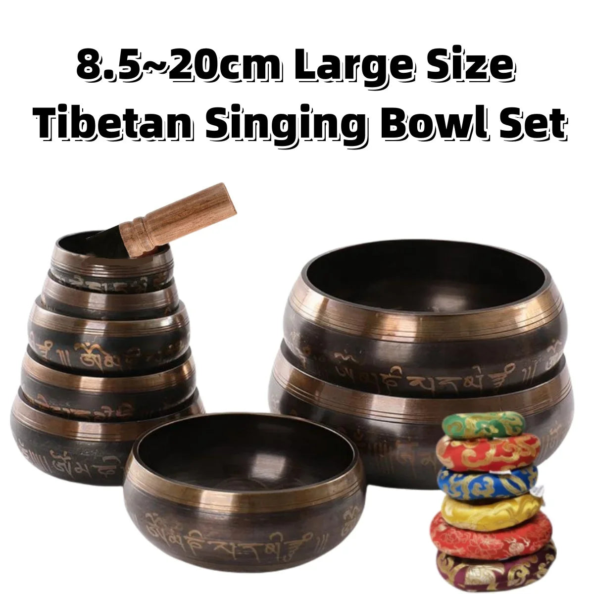 A set of 8.5 to 20cm large Tibetan singing bowls with wooden strikers and decorative cushions.