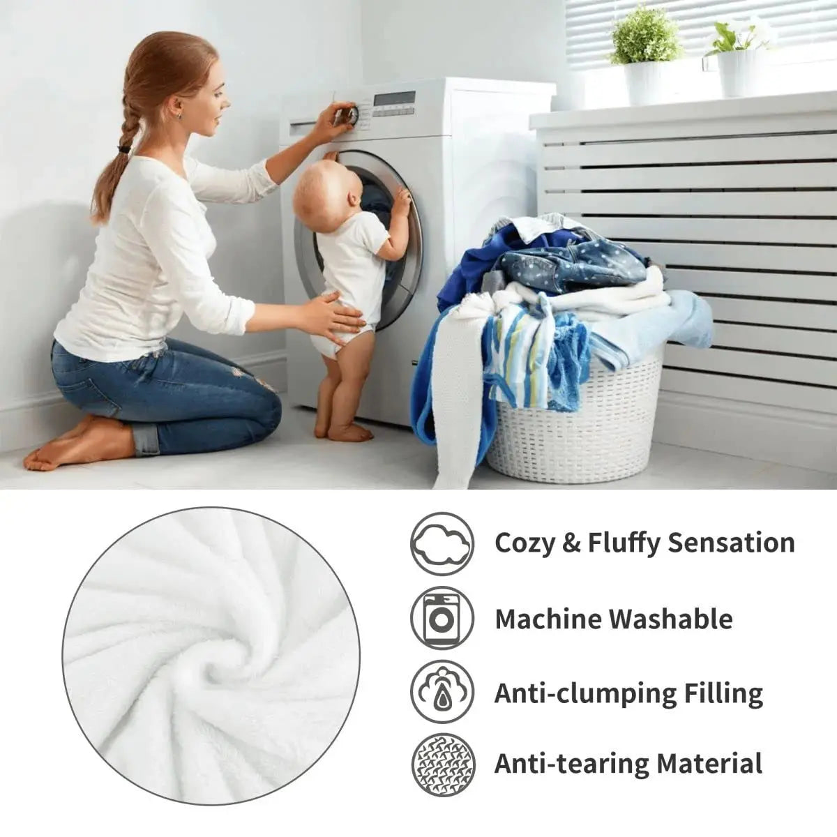 A woman is folding a white fluffy blanket in front of a washing machine with a baby nearby.