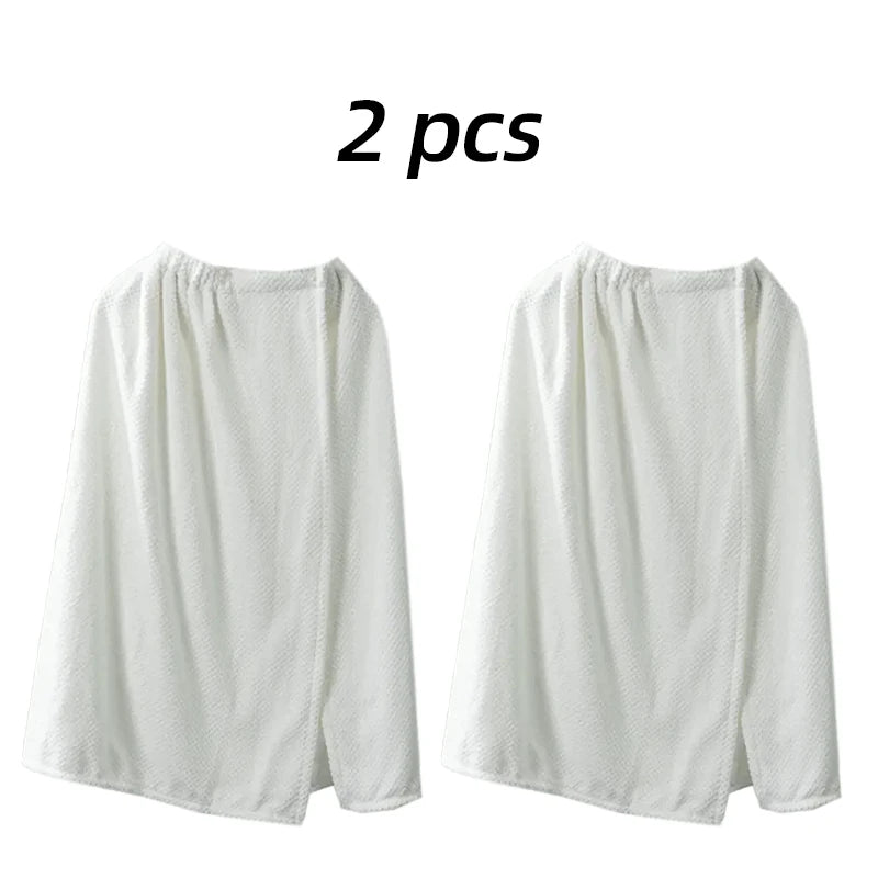 Two white women's quick-dry wearable bathrobe towels displayed side by side.