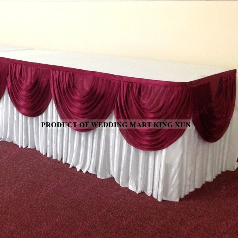 Elegant ice silk table skirt with matching top swag in deep maroon and white fabric.