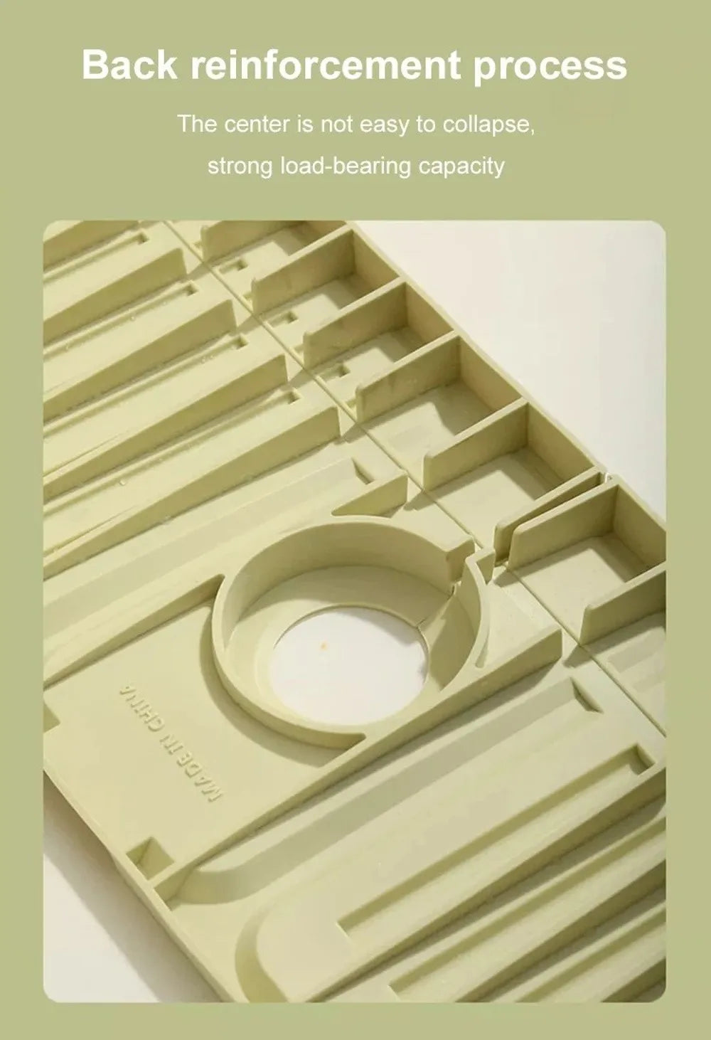 A close-up view of a silicone faucet draining mat with raised edges, showing its structure and texture.