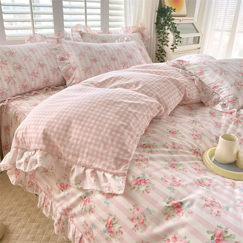 Pink floral ruffle cotton duvet cover set displayed on a bed with white plantation shutters.