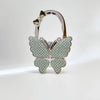 Silver foldable butterfly shaped handbag hook with sparkling details
