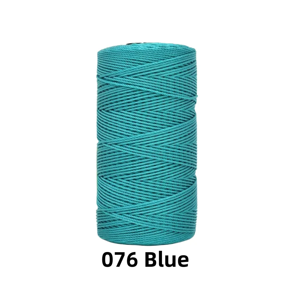 A spool of 1.5mm fine polyester blue crochet yarn for knitting and DIY crafts.