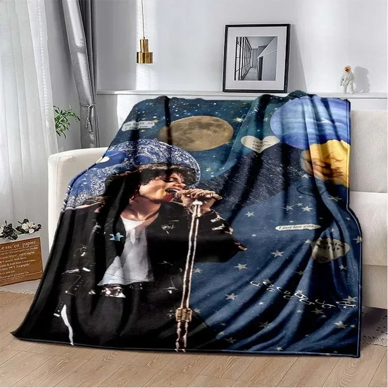 A dark blue and black printed flannel throw blanket featuring a portrait of Michael Jackson.