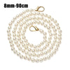 A strand of small, round white pearls on a gold-toned chain with a clasp.
