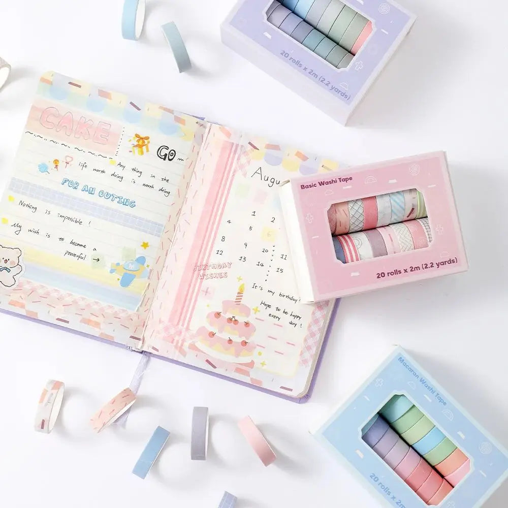 A collection of colorful washi tape rolls in various shades and patterns for journaling and crafts.