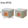 Two grey foldable storage bags with orange bear designs shown from the top and side.