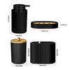 Matte black bathroom accessories set featuring a soap dispenser and holder.