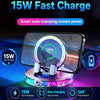 A phone is being fast charged by a wireless auto-clamping charger with an RGB ambient light and 360 degree rotation feature.