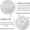 Close-up view of a white duvet cover showing zipper closure and corner ties.