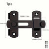 A black stainless steel flip barn door lock with mounting plates and keys.