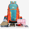 An orange and teal hiking backpack with yellow accents is shown next to various outdoor gear.