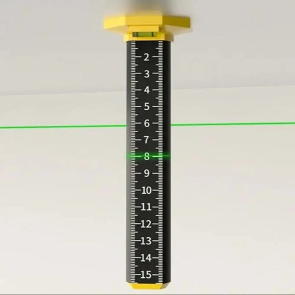 A yellow magnetic ceiling leveling ruler with a black scale marked from 2 to 15 inches.