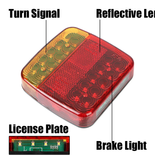 A close-up view of a red automotive brake light assembly with turn signal and license plate features.