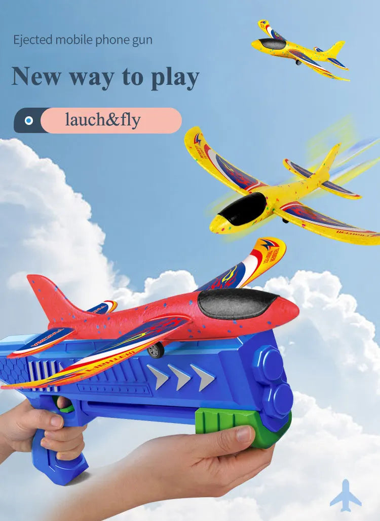A hand holds a blue foam plane launcher, ready to launch a yellow and red foam plane against a cloudy sky.