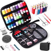A portable sewing kit containing various tools like needles, scissors, and thread spools in an open black case.