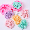 Silicone molds of pink, purple, orange, and teal frangipani gardenia flowers for candle and soap making