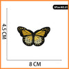 Five embroidered butterfly and rose iron-on patches, yellow and black.