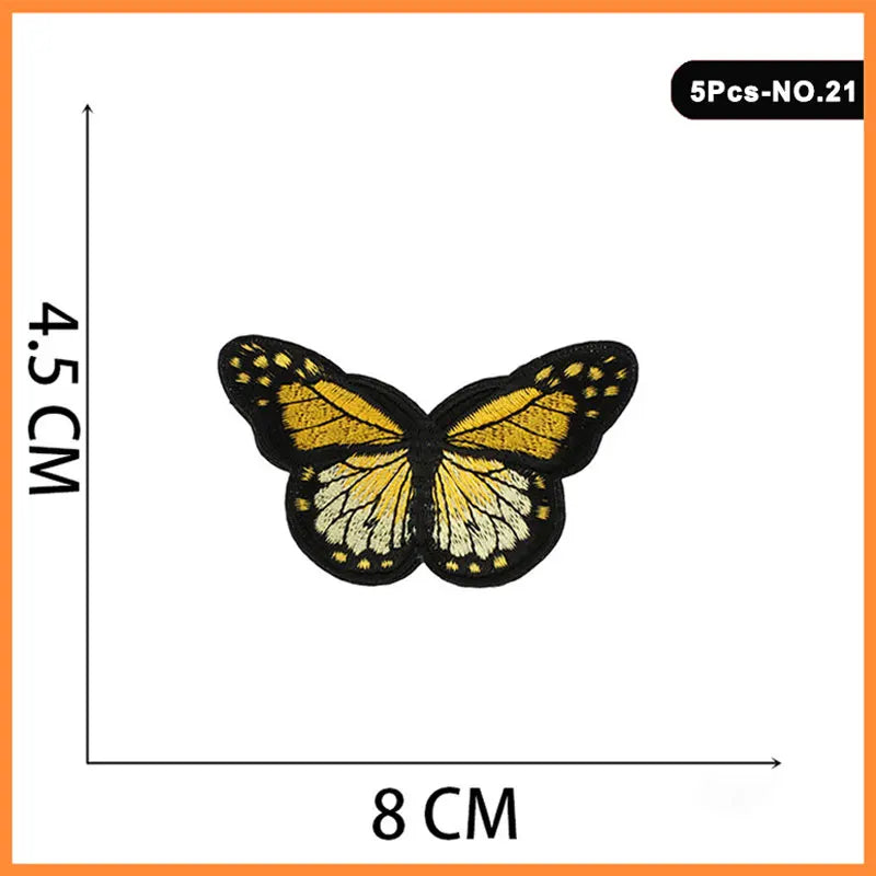 Five embroidered butterfly and rose iron-on patches, yellow and black.