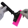 A hand is holding an 8-inch rubber squeegee with an anti-slip nylon handle, positioned to clean a pink surface.