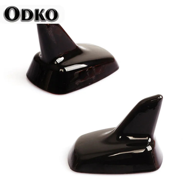 A sleek, black shark fin roof antenna for VW and Audi models.