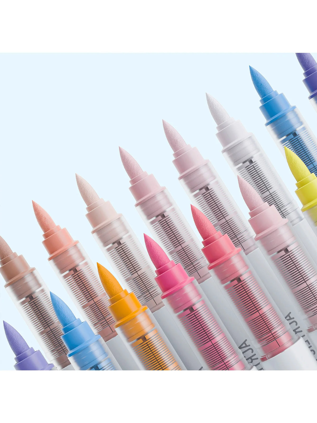 A collection of nine acrylic paint marker pens in various colors and shades with fine tips.