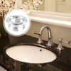 Chrome-plated sink overflow cover set with a spout and handles shown above a bathroom sink.
