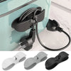 A set of black cord organizers and wire winders for tidy cable management, shown in various shades of gray and black.