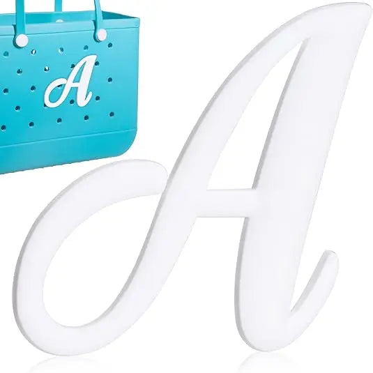 A white alphabet letter A charm is displayed next to a teal grid bag charm.