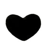 A black heart-shaped plush throw pillow.
