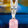 Silver stainless steel rhinestone cross pendant with a pink textured sphere charm