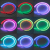 A grid showing various colors of an RGB LED car hood light strip illuminating a circular area.