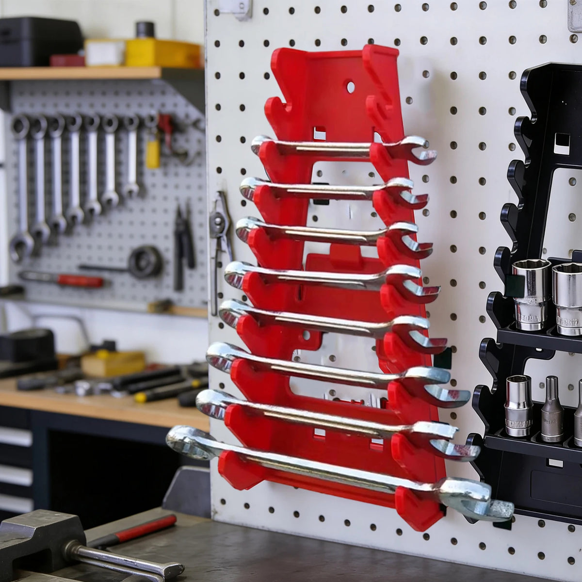 A red and silver heavy-duty wrench organizer tray with multi-slot storage racks mounted on a white pegboard.