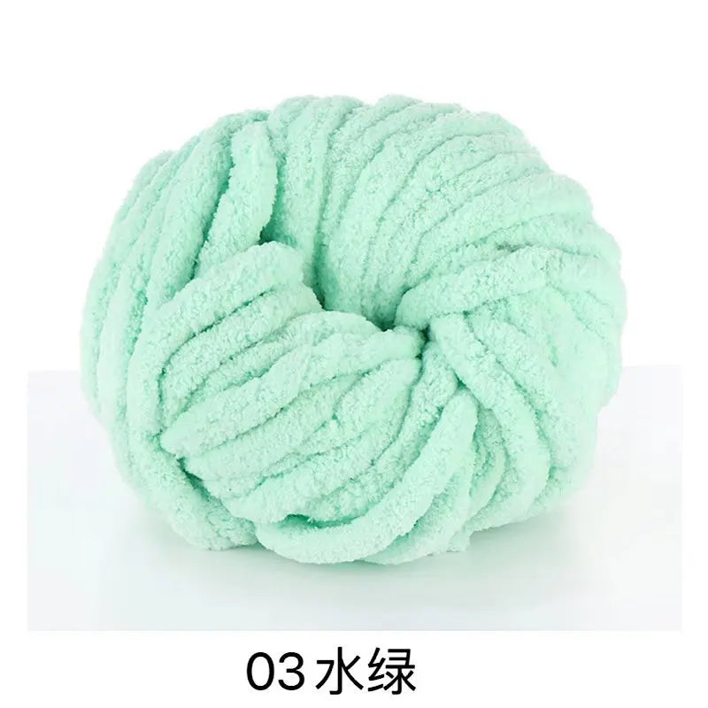 A ball of light mint green chunky acrylic yarn for knitting and crochet