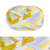A ball of chunky chenille yarn featuring a marbled pattern of yellow and gray.