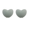 A pair of smooth, heart-shaped silicone beads in a light gray color.
