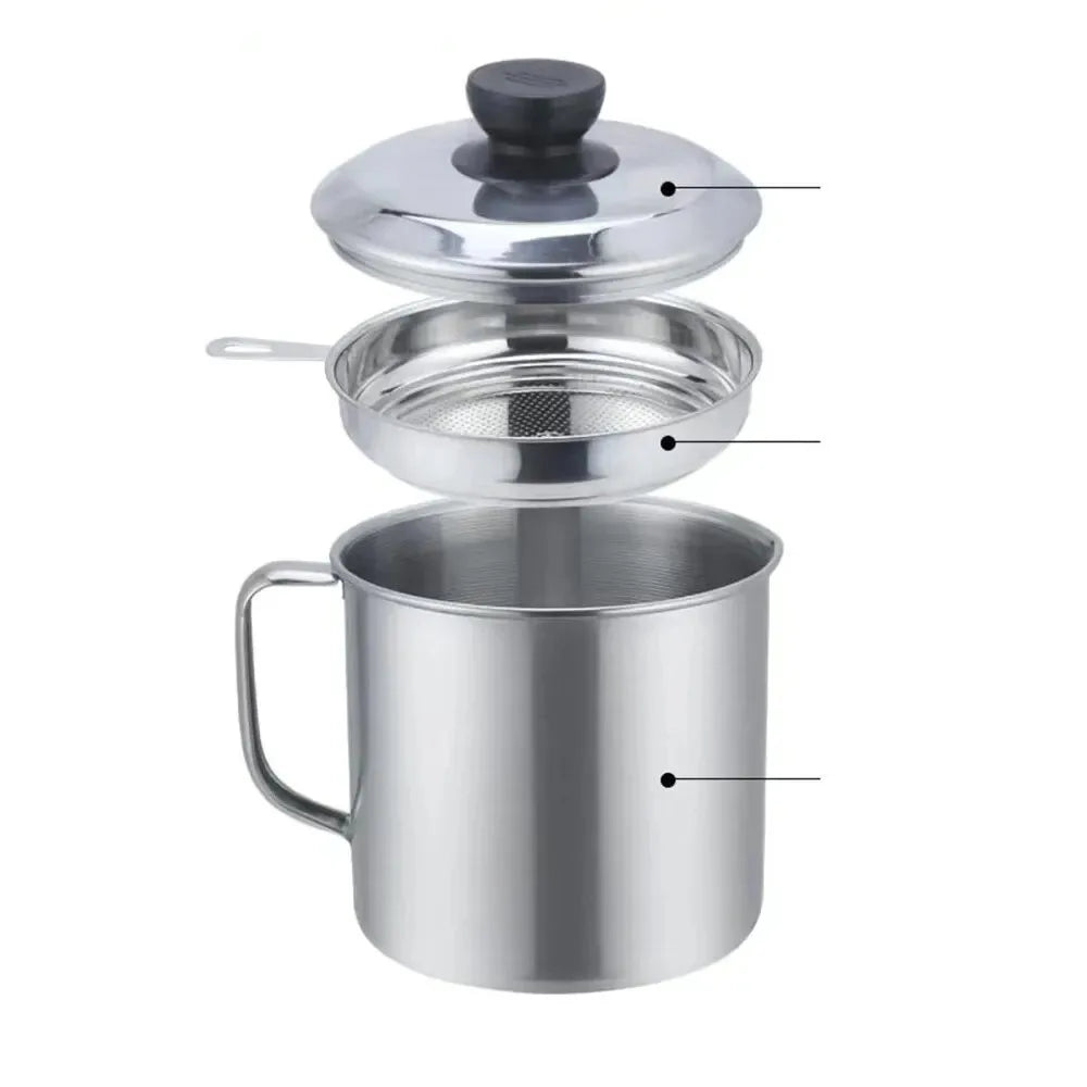 Stainless steel kitchen grease strainer with a lid and storage jar.