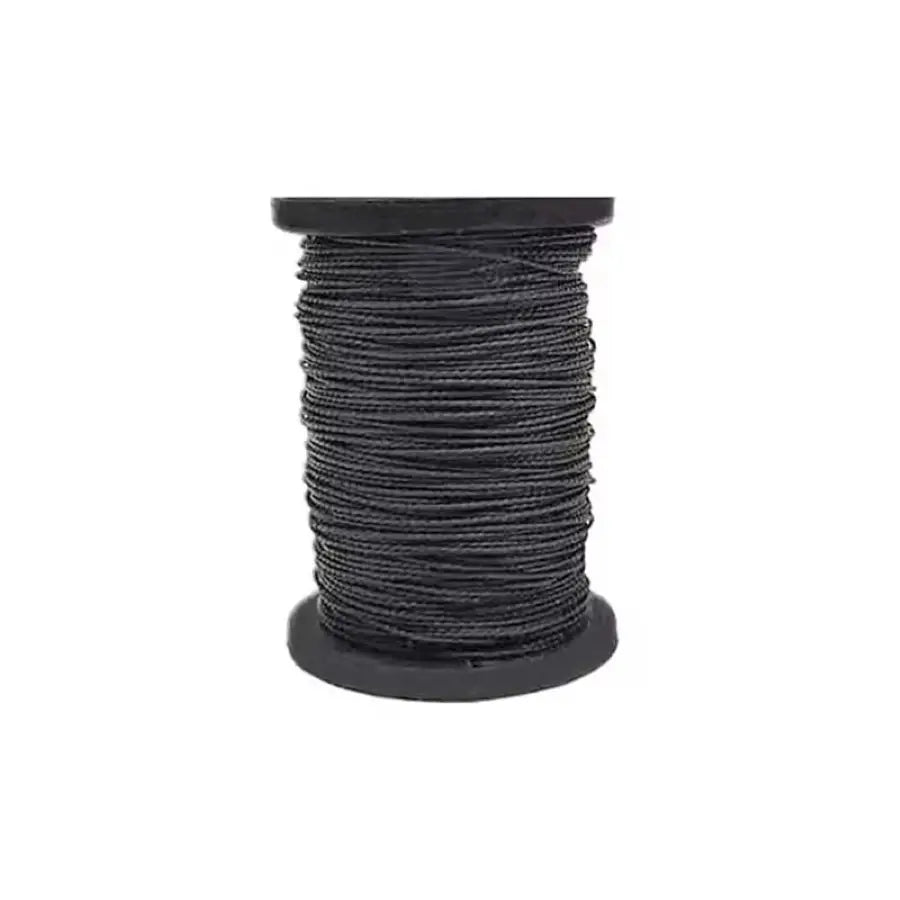A spool of black waxed thread used in a professional leather sewing kit.