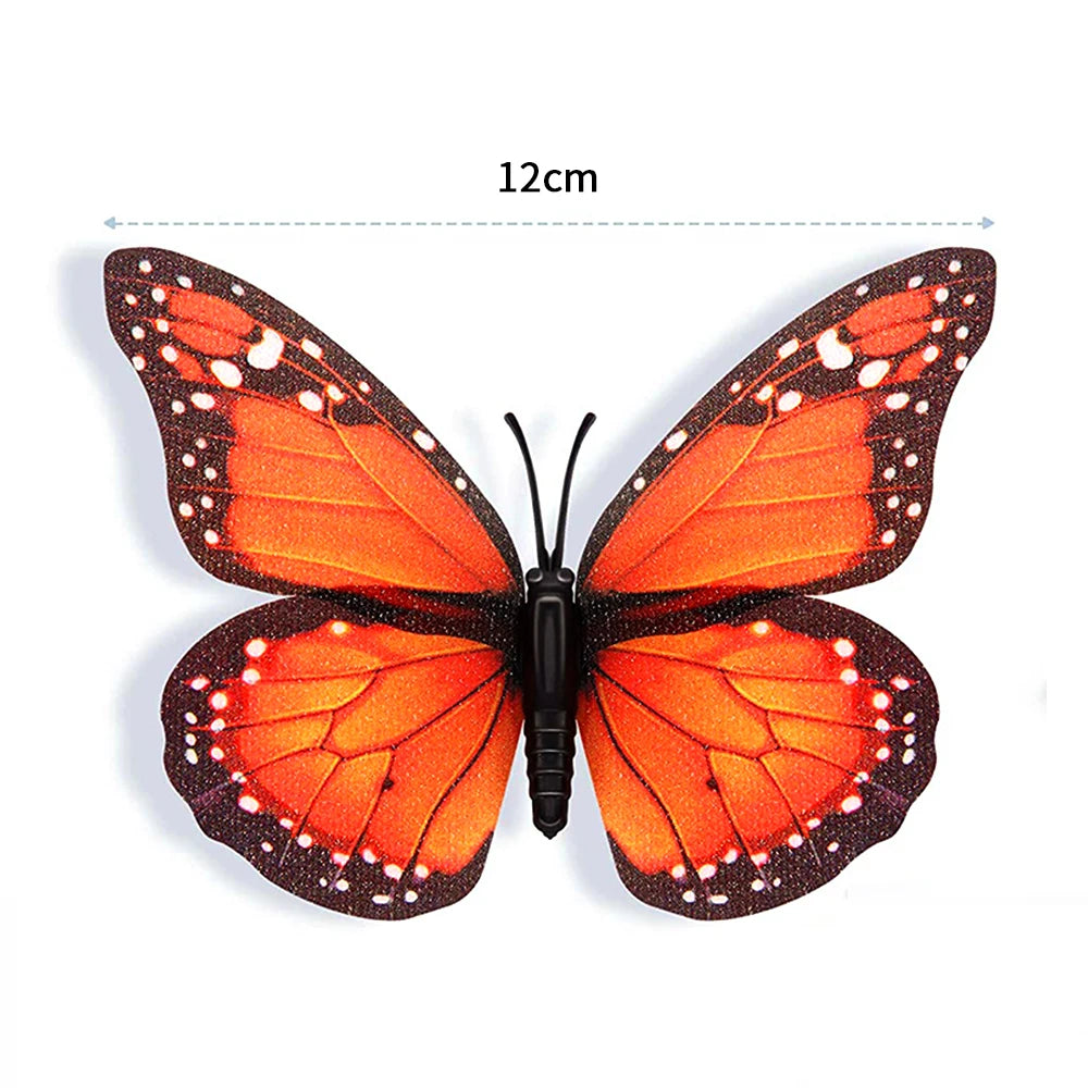 A pair of realistic orange and black monarch butterfly magnets with adhesive backing.