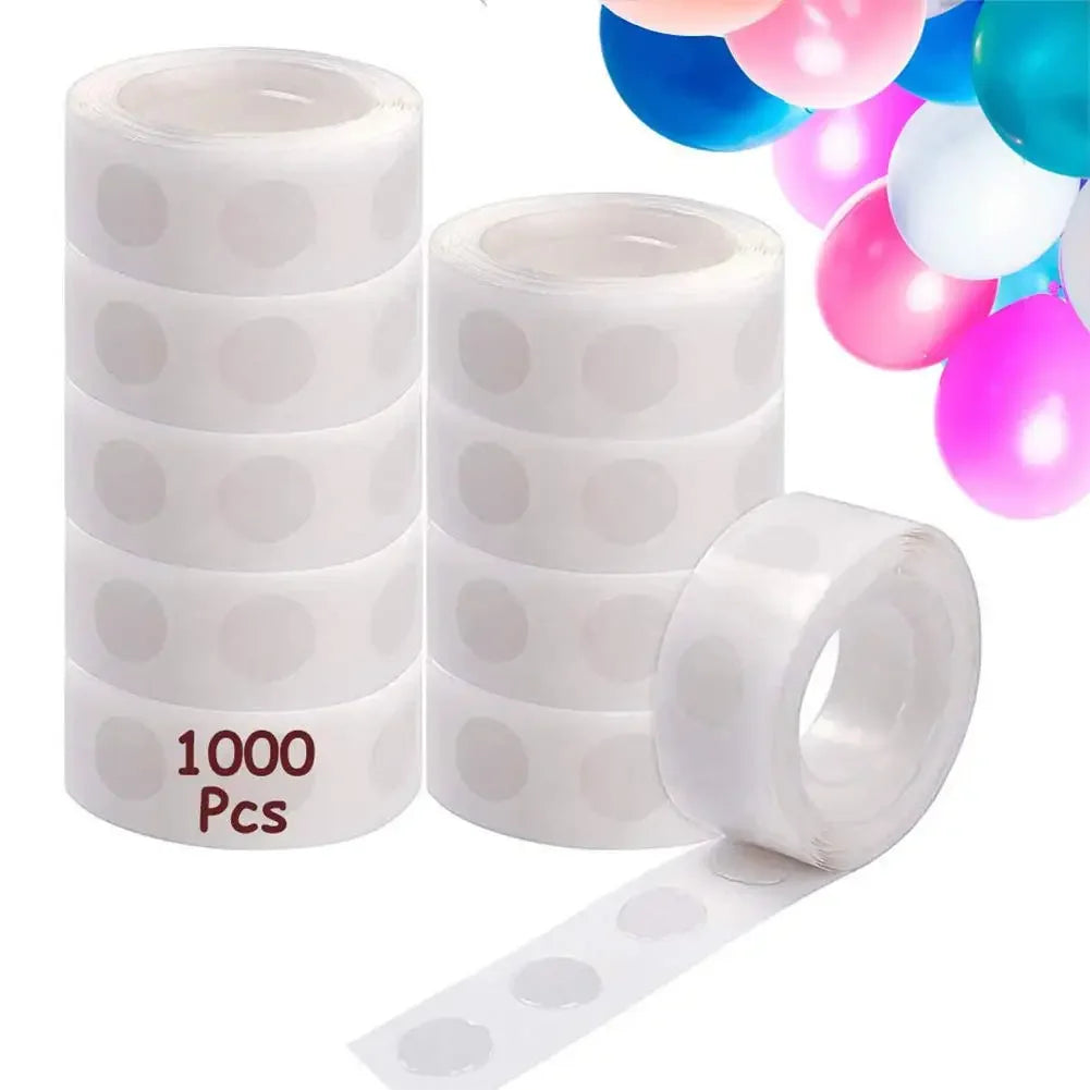 Rolls of removable double-sided adhesive dots in various colors and a single roll of white dots for DIY crafts